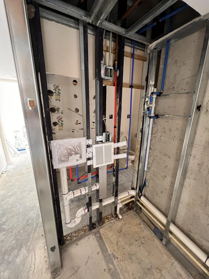 Bathroom rough-in with plumbing supply, waste, vent and electrical boxes